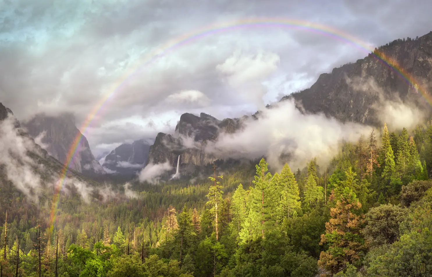 Rainbow, clearing spring storm, Yosemite, California
